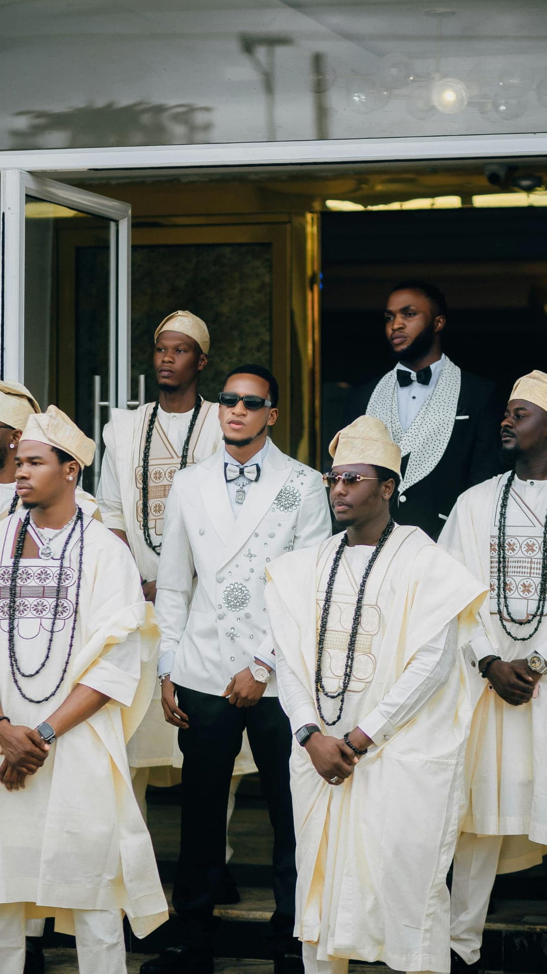 Groomsmen in white agbada