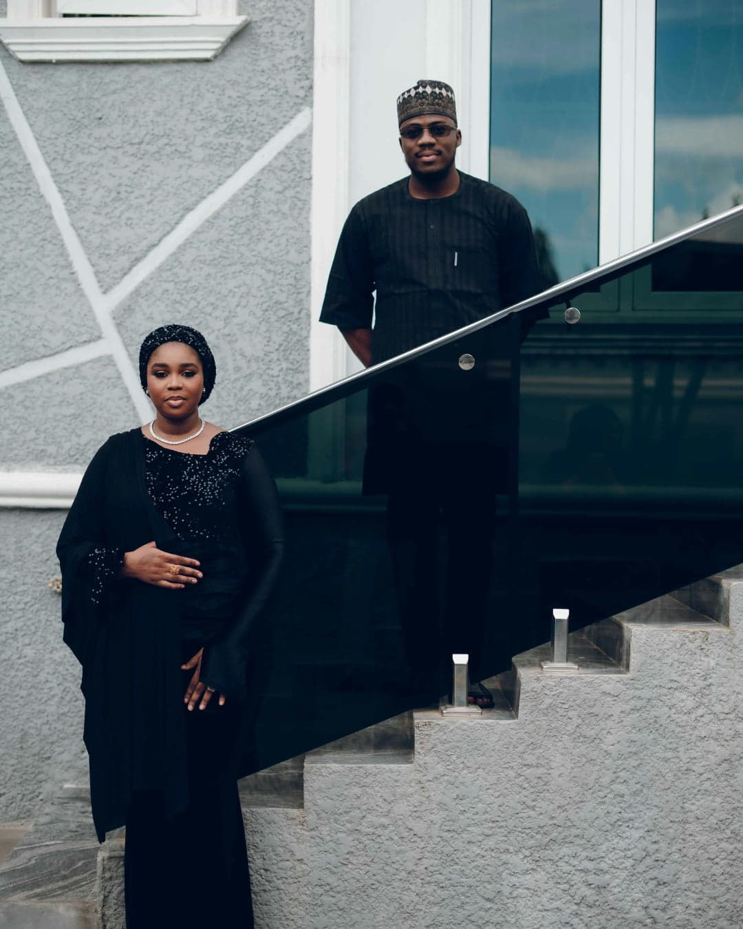 Couple on staircase in black