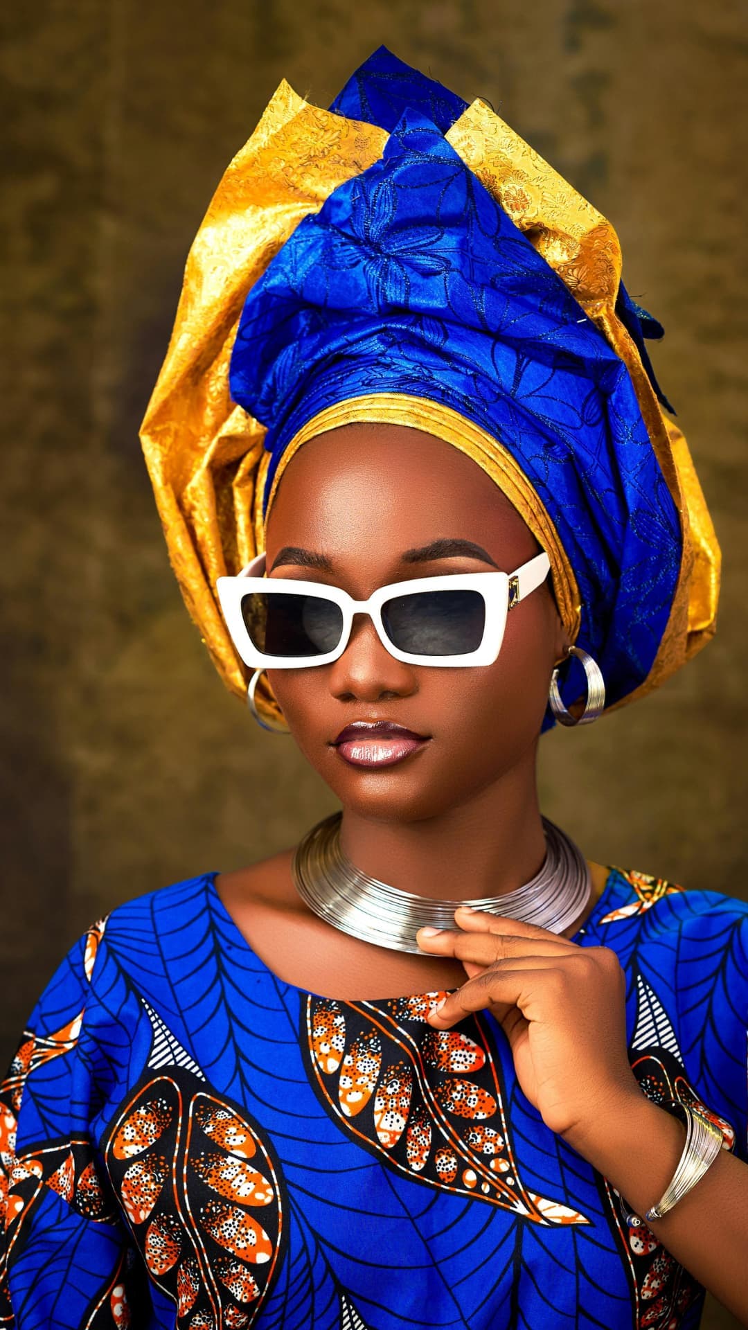 Woman in blue ankara with sunglasses