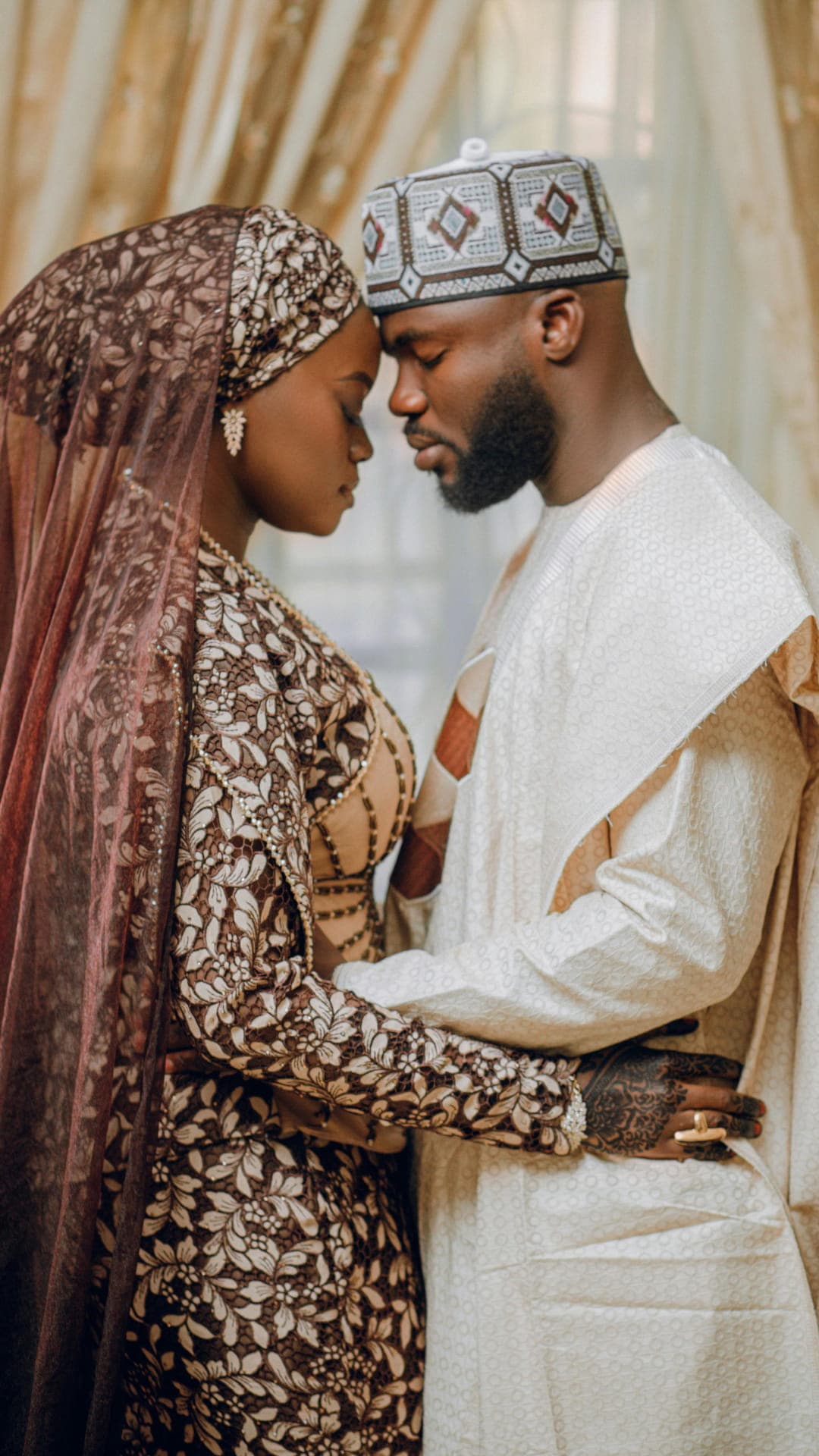 Northern couple foreheads together