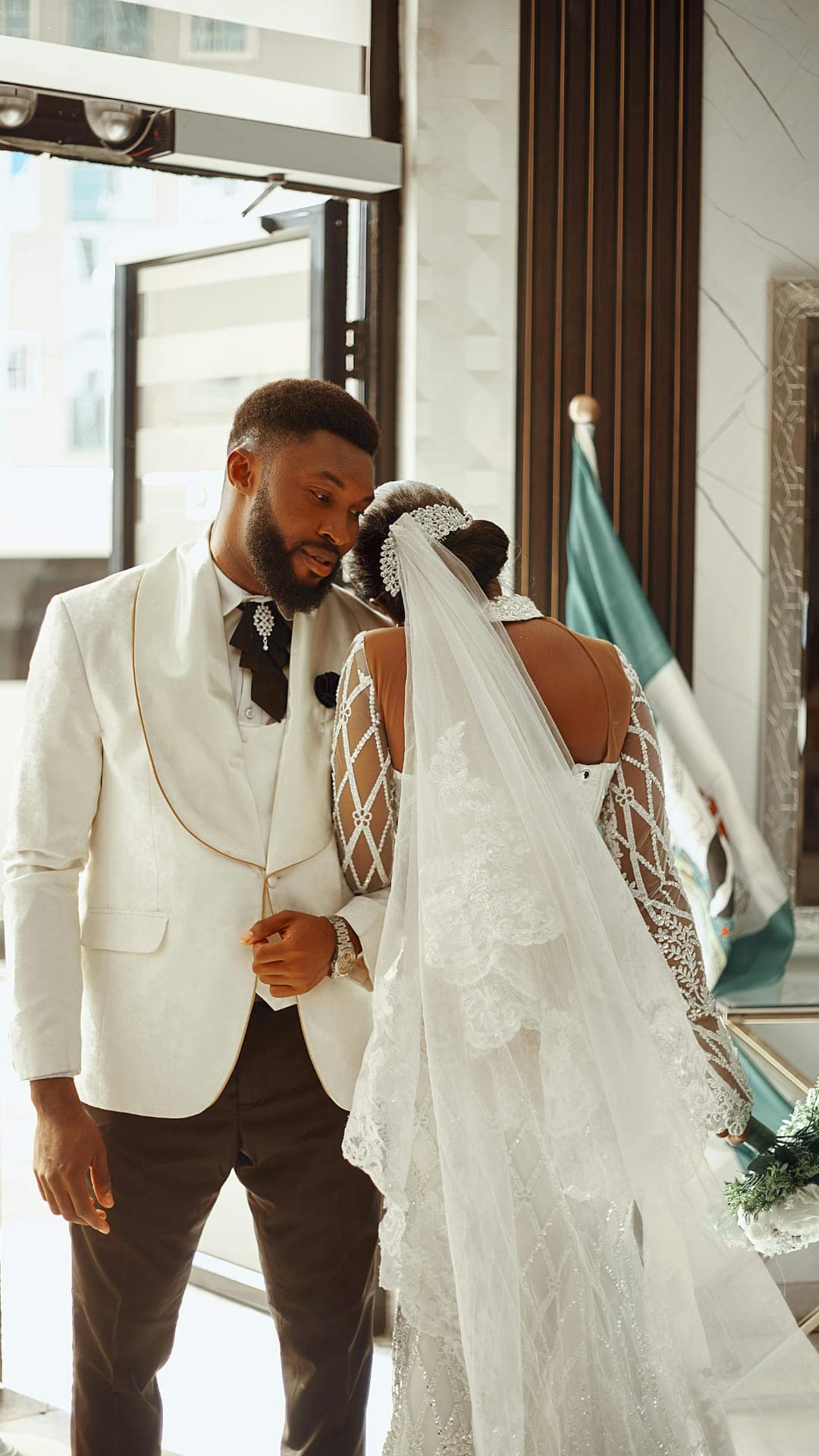 Couple in white tuxedo and dress