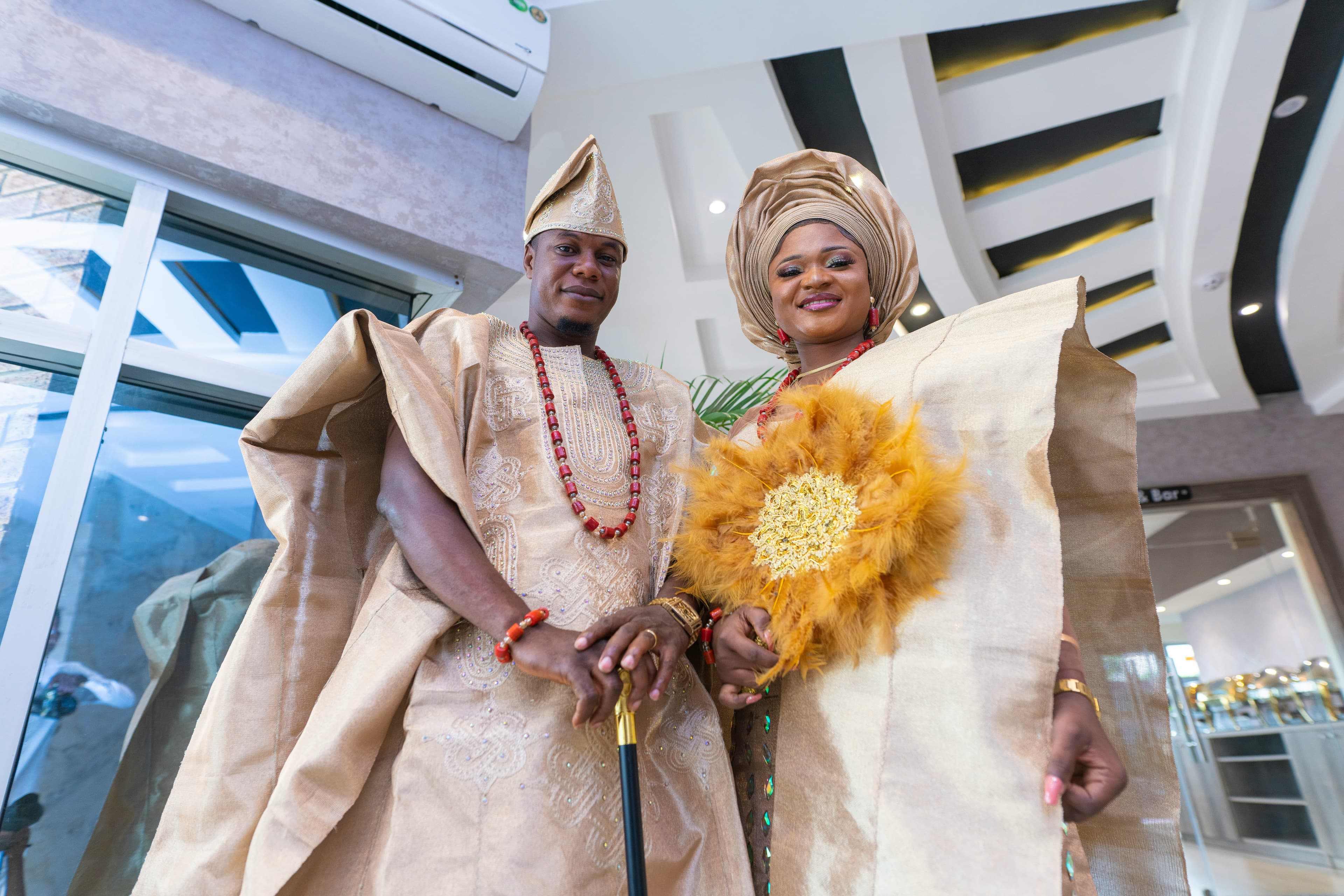 Yoruba couple in gold aso oke