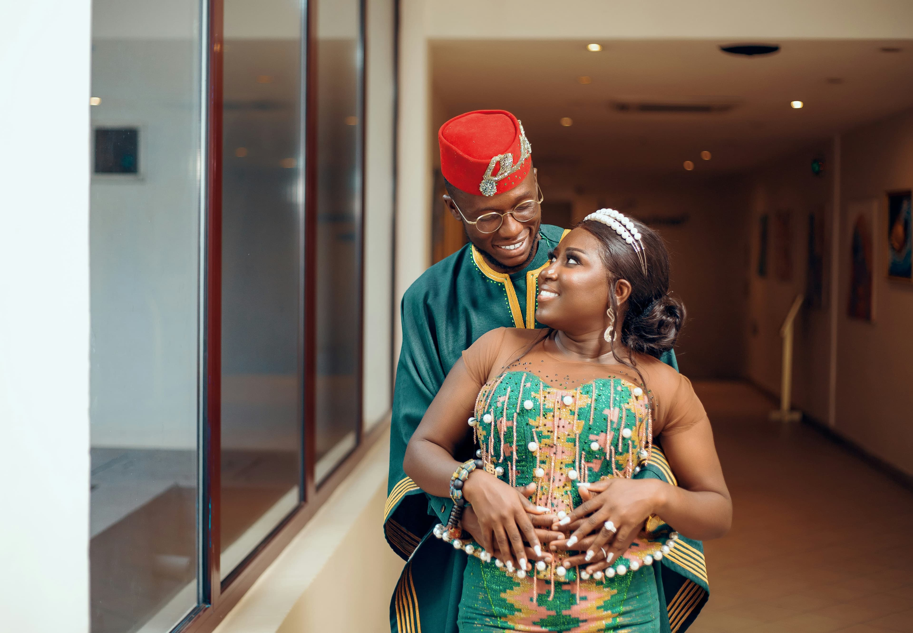 Igbo couple in green and red traditional