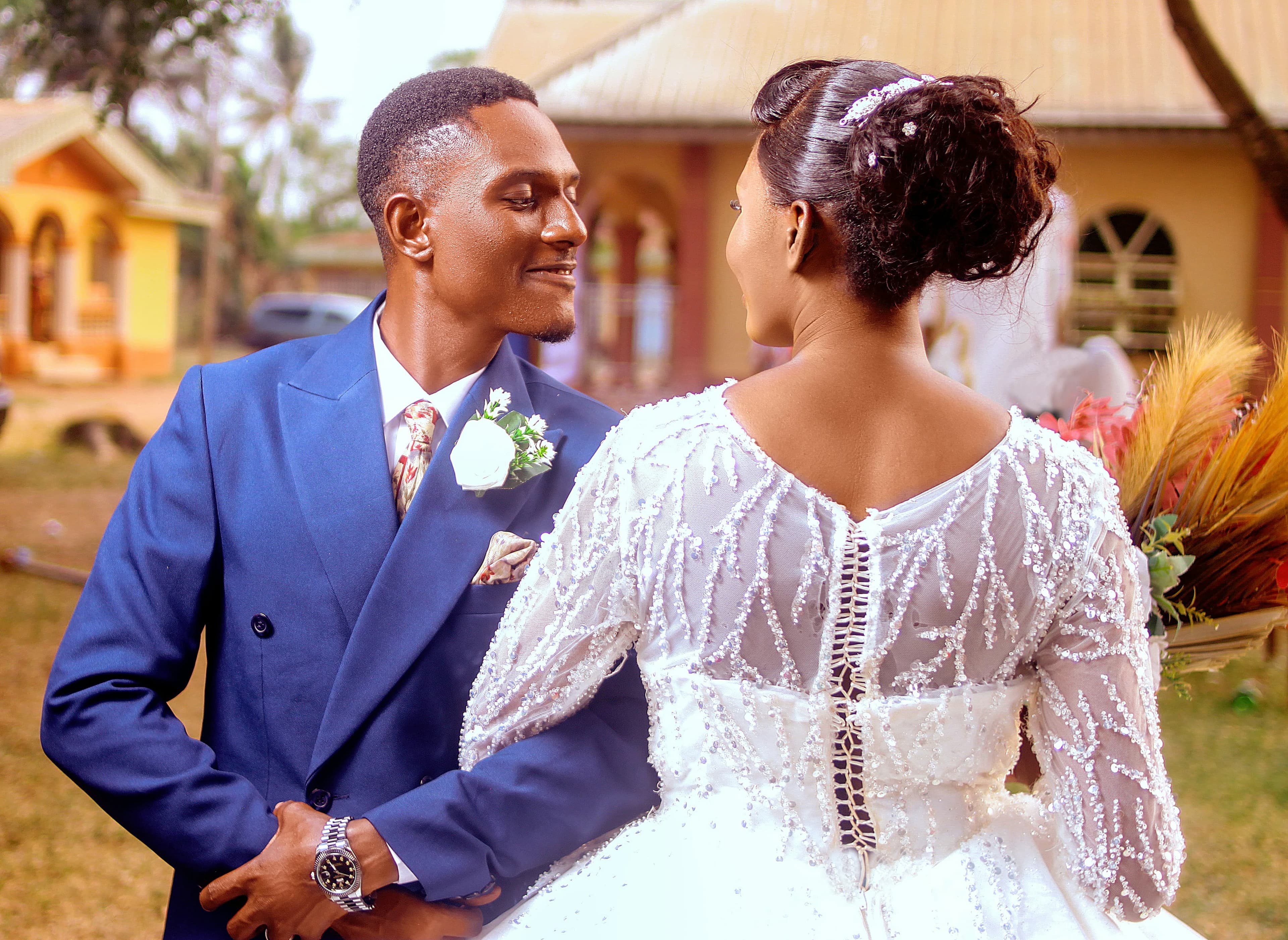 Couple at church wedding in blue suit